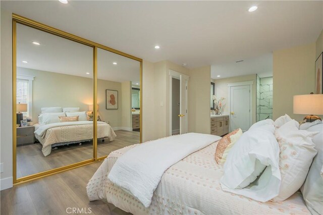 2445 Ocean View Dr, Upland, CA 91784 - bedroom with wood finished floors, a closet, and recessed lighting
