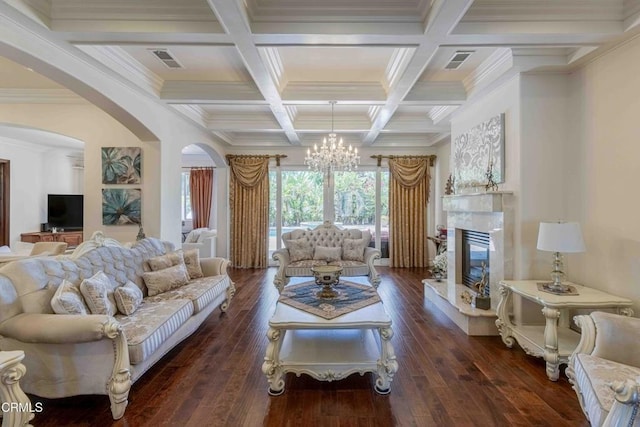 3007 Springbank Ct, Bakersfield, CA 93311 - living area featuring a chandelier, beamed ceiling, arched walkways, dark wood-style flooring, and coffered ceiling