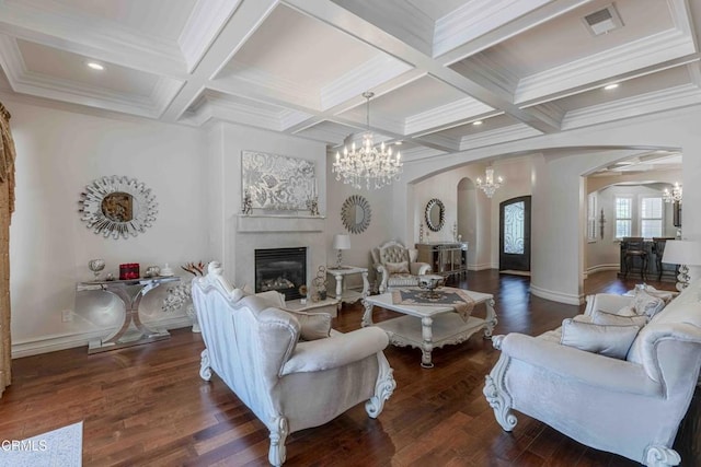 3007 Springbank Ct, Bakersfield, CA 93311 - living area featuring arched walkways, a chandelier, a glass covered fireplace, beam ceiling, and coffered ceiling