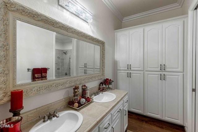 3007 Springbank Ct, Bakersfield, CA 93311 - bathroom with tiled shower, double vanity, wood finished floors, and crown molding