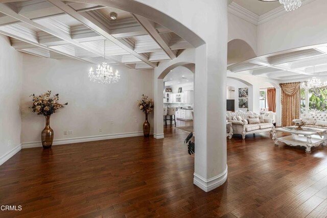 3007 Springbank Ct, Bakersfield, CA 93311 - living room featuring a chandelier, coffered ceiling, arched walkways, beam ceiling, and dark wood-style flooring
