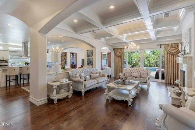 3007 Springbank Ct, Bakersfield, CA 93311 - living area featuring a chandelier, arched walkways, coffered ceiling, beam ceiling, and dark wood finished floors