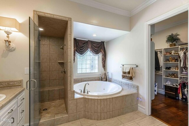 3007 Springbank Ct, Bakersfield, CA 93311 - full bath with a tub with jets, a stall shower, vanity, a spacious closet, and tile patterned floors