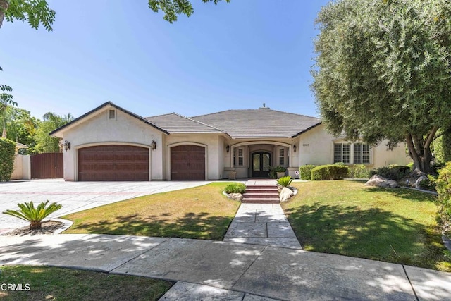 3007 Springbank Ct, Bakersfield, CA 93311 - french country inspired facade with stucco siding, a garage, driveway, and french doors