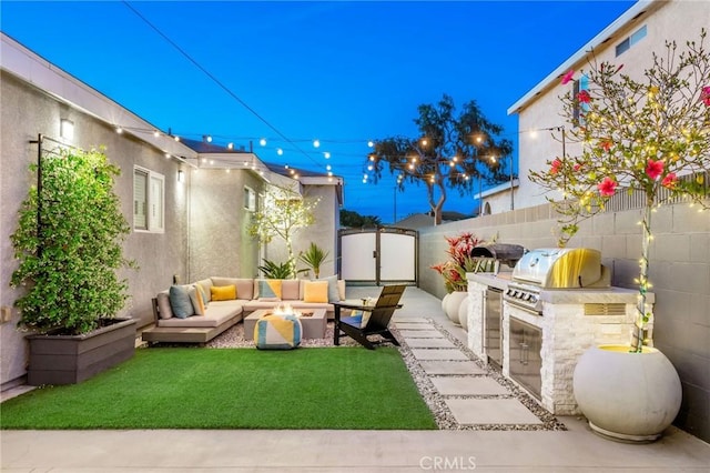 4852 W 129th St, Hawthorne, CA 90250 - view of patio with exterior kitchen and an outdoor living space