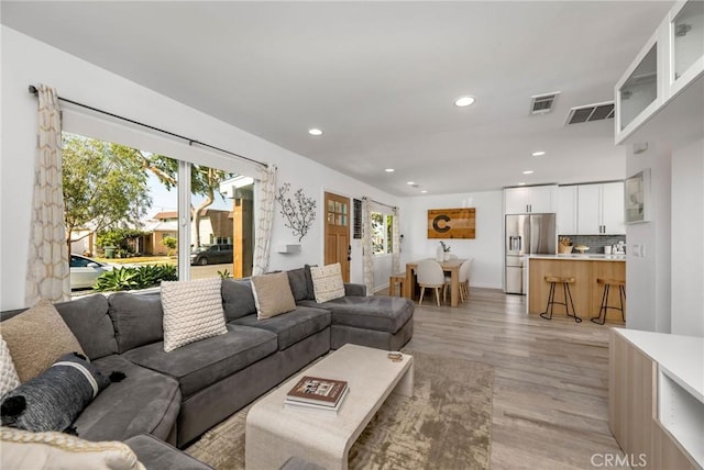 4852 W 129th St, Hawthorne, CA 90250 - living room with light wood-style flooring and recessed lighting