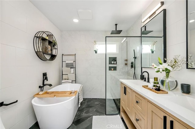 4852 W 129th St, Hawthorne, CA 90250 - full bathroom featuring tile walls, a walk in shower, a soaking tub, double vanity, and marble finish flooring