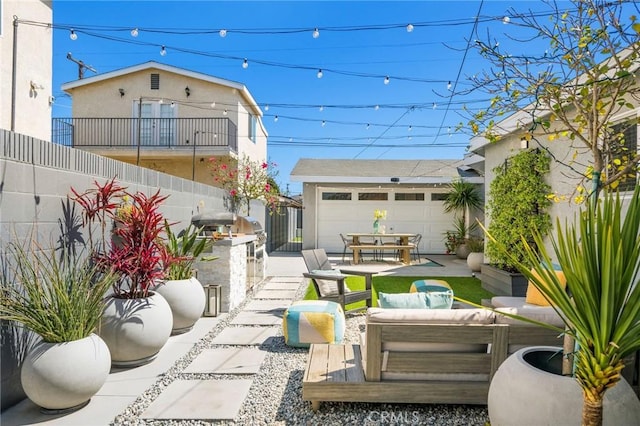 4852 W 129th St, Hawthorne, CA 90250 - view of patio with an outdoor living space and a garage