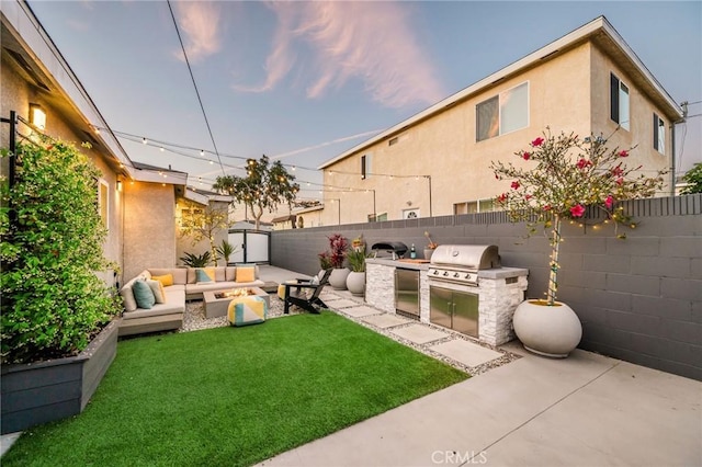 4852 W 129th St, Hawthorne, CA 90250 - fenced backyard with area for grilling, outdoor lounge area, and a patio area