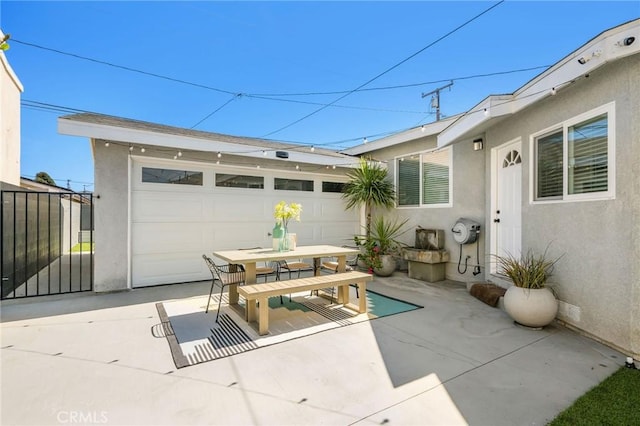 4852 W 129th St, Hawthorne, CA 90250 - view of patio / terrace with outdoor dining space, a garage, and an outdoor structure