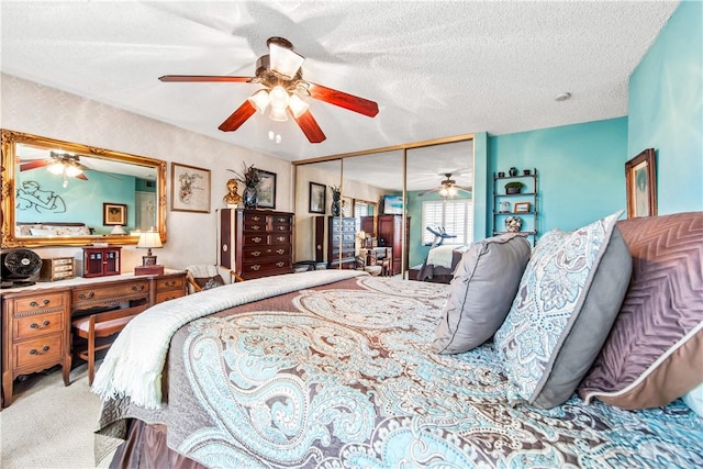 5471 E Centralia St Unit 24, Long Beach, CA 90808 - carpeted bedroom featuring a closet, ceiling fan, and a textured ceiling