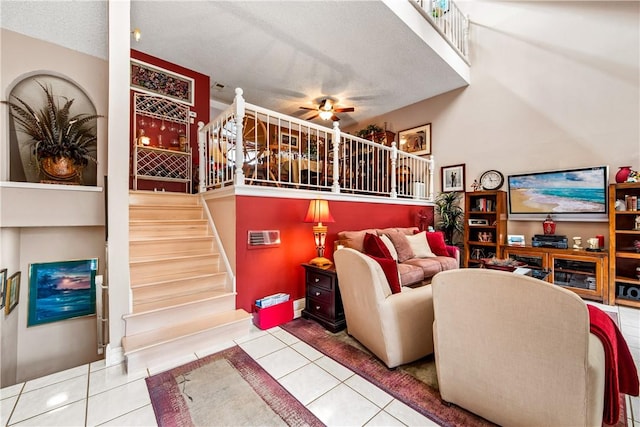 5471 E Centralia St Unit 24, Long Beach, CA 90808 - tiled living area with a ceiling fan and stairway