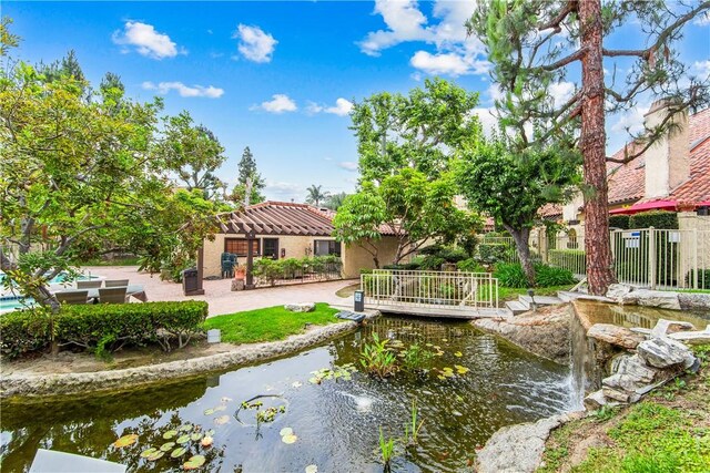 5471 E Centralia St Unit 24, Long Beach, CA 90808 - view of home's community featuring a small pond