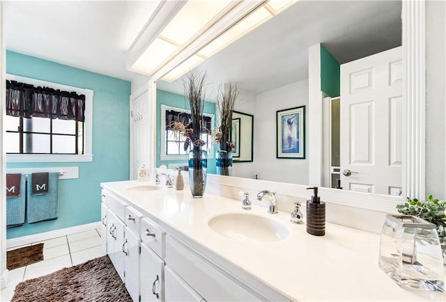 5471 E Centralia St Unit 24, Long Beach, CA 90808 - full bathroom with tile patterned floors, double vanity, and baseboards