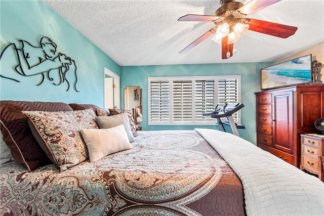 5471 E Centralia St Unit 24, Long Beach, CA 90808 - bedroom with a textured ceiling and ceiling fan