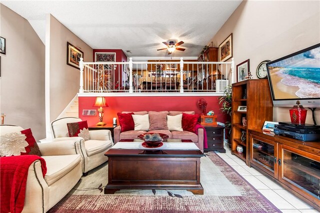 5471 E Centralia St Unit 24, Long Beach, CA 90808 - tiled living area with stairs and ceiling fan