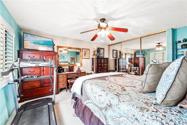 5471 E Centralia St Unit 24, Long Beach, CA 90808 - bedroom with carpet floors, a closet, a textured ceiling, and ceiling fan