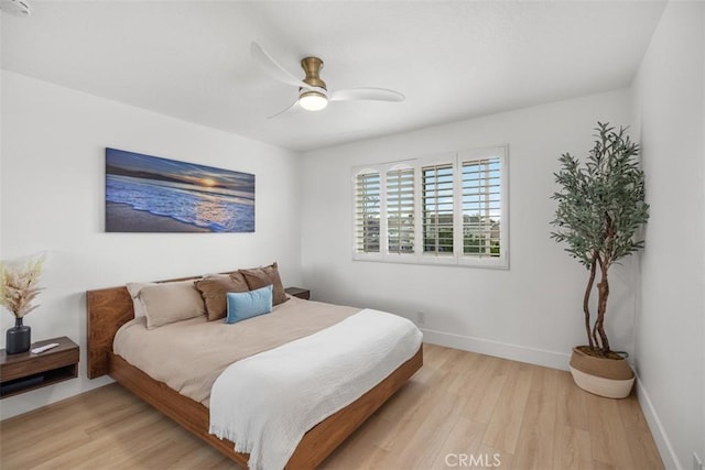 20092 Bayfront Ln Unit 206, Huntington Beach, CA 92646 - bedroom featuring light wood-style flooring, baseboards, and a ceiling fan