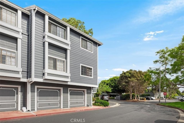 20092 Bayfront Ln Unit 206, Huntington Beach, CA 92646 - view of side of property with an attached garage