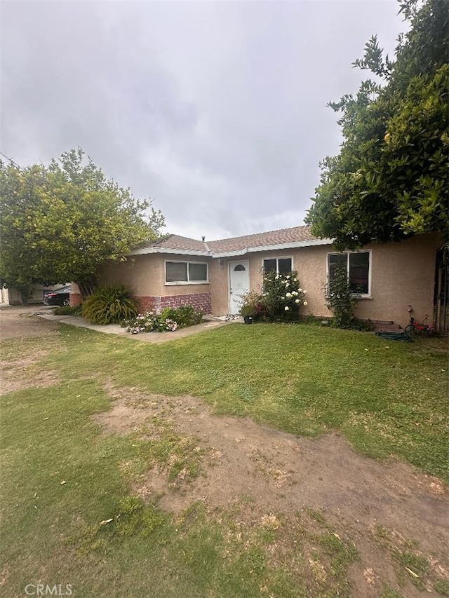 4574 La Madera Ave, El Monte, CA 91732 - ranch-style home featuring stucco siding, a front lawn, and brick siding