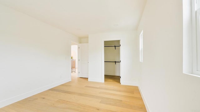 3728 Wawona Dr, San Diego, CA 92107 - unfurnished bedroom featuring light wood-type flooring, baseboards, and a spacious closet