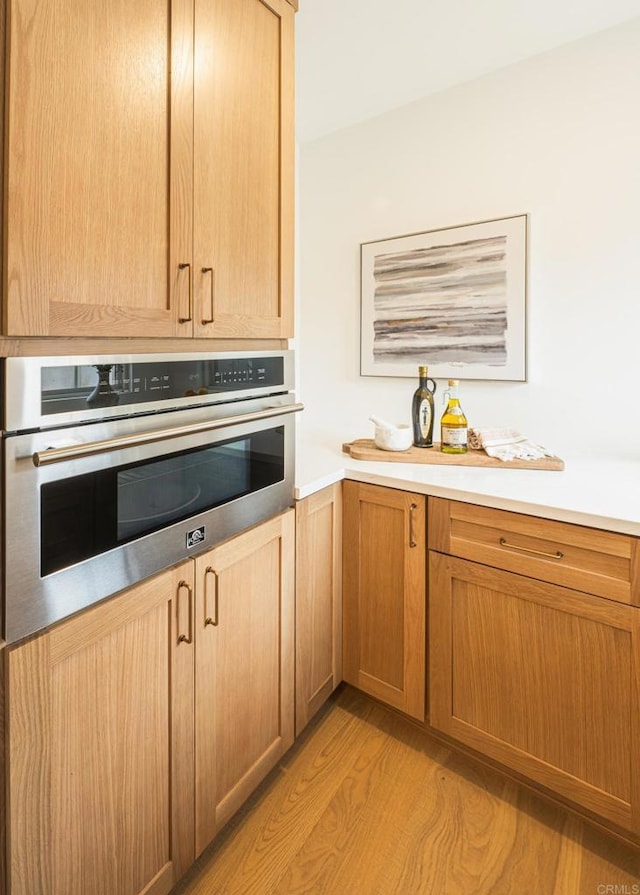 3728 Wawona Dr, San Diego, CA 92107 - kitchen with oven, light wood finished floors, and light countertops