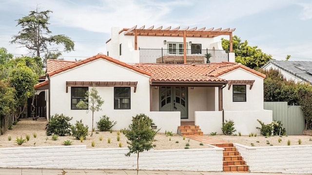 3728 Wawona Dr, San Diego, CA 92107 - mediterranean / spanish house featuring a tile roof, stucco siding, a pergola, and a balcony