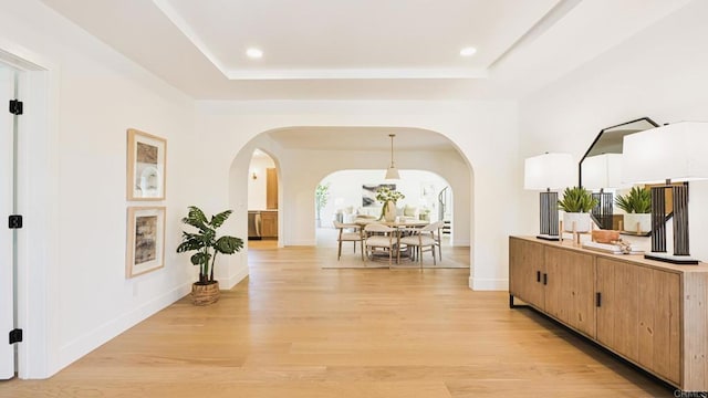 3728 Wawona Dr, San Diego, CA 92107 - corridor with arched walkways, light wood-type flooring, a raised ceiling, and recessed lighting