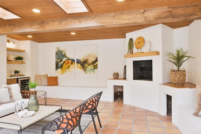 3728 Wawona Dr, San Diego, CA 92107 - living area featuring a fireplace, a skylight, beverage cooler, recessed lighting, and wooden ceiling