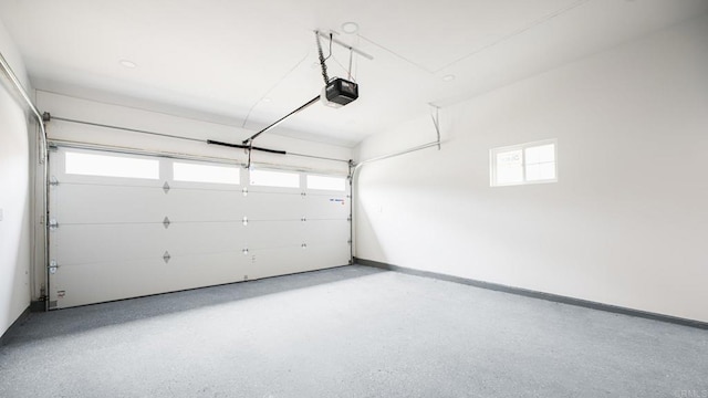 3728 Wawona Dr, San Diego, CA 92107 - garage featuring a garage door opener and baseboards