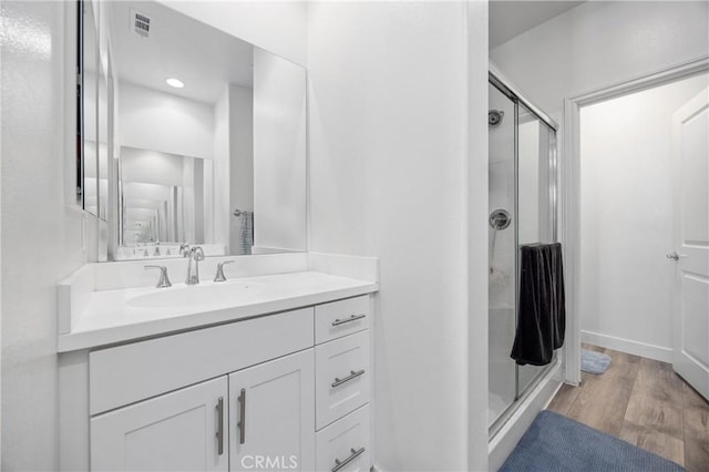 11437 Excelsior Dr Unit C, Norwalk, CA 90650 - full bath featuring a shower stall, vanity, wood finished floors, recessed lighting, and baseboards