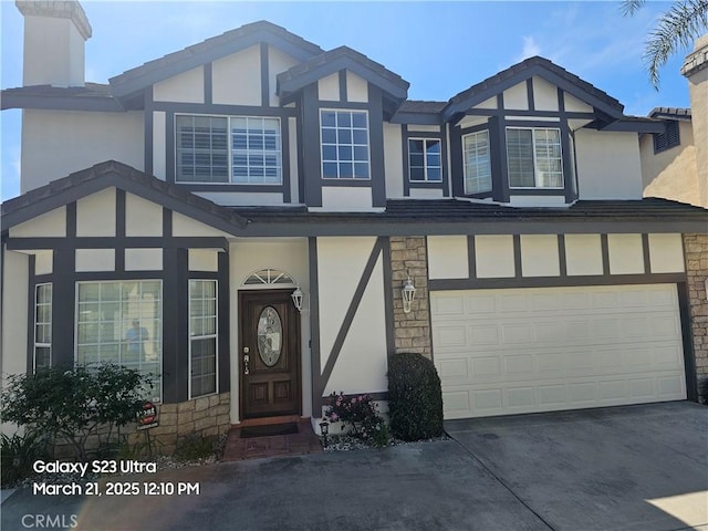 1849 10th Ave, Monrovia, CA 91016 - view of front of house with stucco siding, stone siding, concrete driveway, and a garage