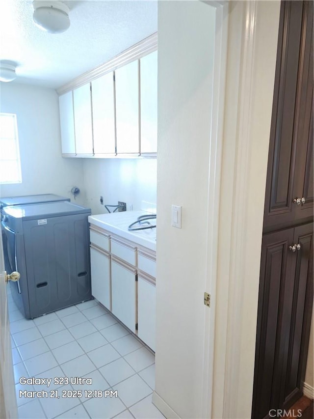 1849 10th Ave, Monrovia, CA 91016 - laundry room featuring cabinet space, washer / clothes dryer, light tile patterned floors, and a textured ceiling