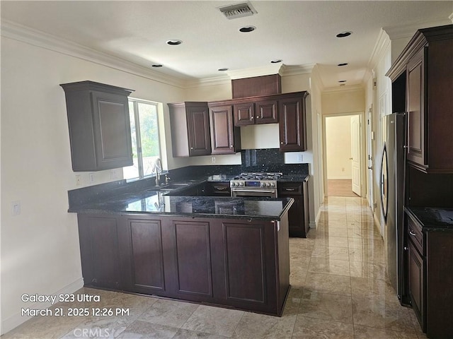 1849 10th Ave, Monrovia, CA 91016 - kitchen with stainless steel appliances, a peninsula, baseboards, a sink, and decorative backsplash