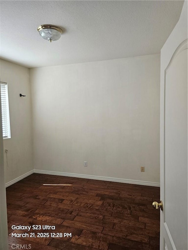 1849 10th Ave, Monrovia, CA 91016 - unfurnished room with dark wood-style flooring, baseboards, and a textured ceiling