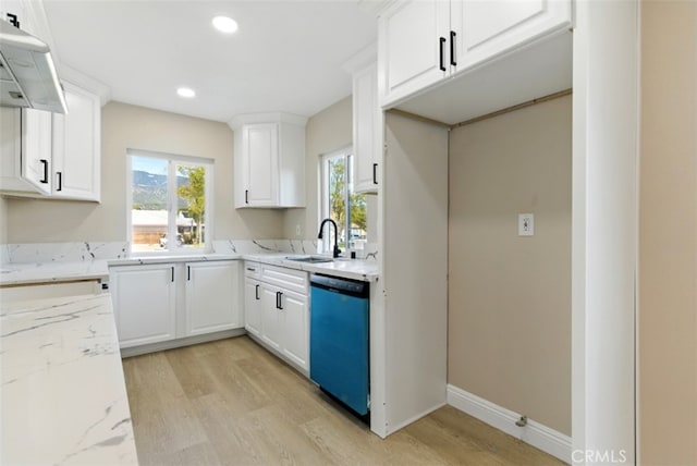 1551 Indian Trl, San Bernardino, CA 92407 - kitchen with dishwasher, a sink, light wood-style floors, ventilation hood, and light stone countertops