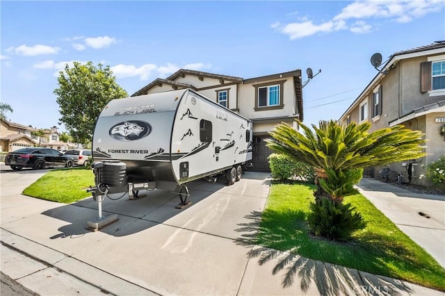 7925 Hemingway Ct, Fontana, CA 92336 - view of front of property with a garage