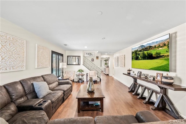 7925 Hemingway Ct, Fontana, CA 92336 - living area featuring wood finished floors, stairway, baseboards, and recessed lighting