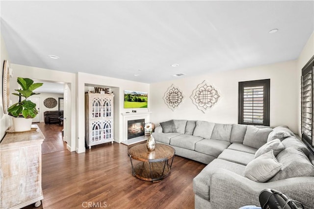 7925 Hemingway Ct, Fontana, CA 92336 - living room with wood finished floors, a glass covered fireplace, and recessed lighting