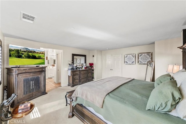 7925 Hemingway Ct, Fontana, CA 92336 - bedroom featuring light colored carpet, ensuite bathroom, and a closet
