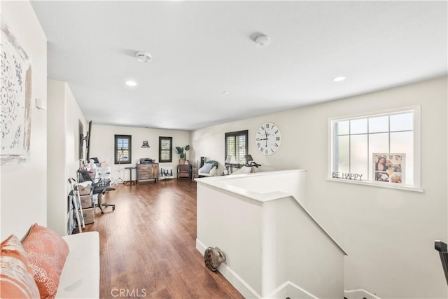 7925 Hemingway Ct, Fontana, CA 92336 - hallway with an upstairs landing, plenty of natural light, dark wood finished floors, recessed lighting, and baseboards