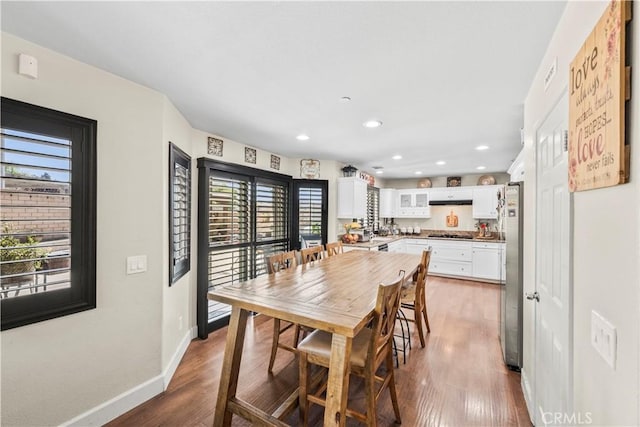 7925 Hemingway Ct, Fontana, CA 92336 - dining room featuring plenty of natural light, wood finished floors, recessed lighting, and baseboards