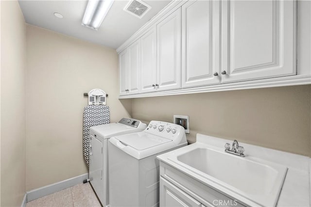 7925 Hemingway Ct, Fontana, CA 92336 - laundry room featuring cabinet space, baseboards, independent washer and dryer, and light tile patterned floors