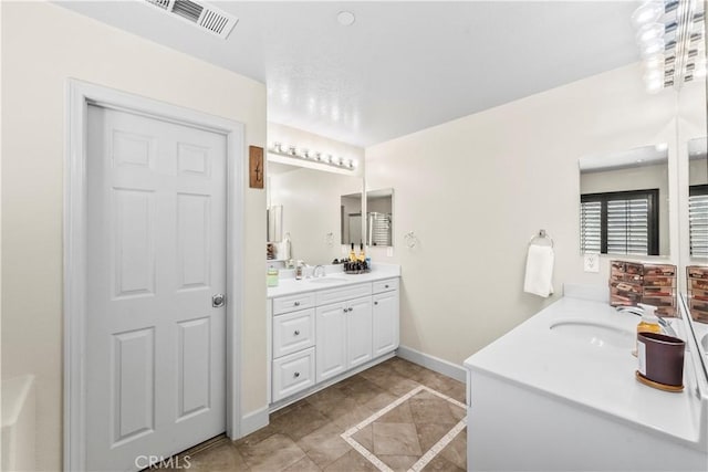 7925 Hemingway Ct, Fontana, CA 92336 - bathroom featuring vanity and baseboards