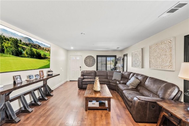 7925 Hemingway Ct, Fontana, CA 92336 - living room featuring light wood-style flooring, baseboards, and recessed lighting
