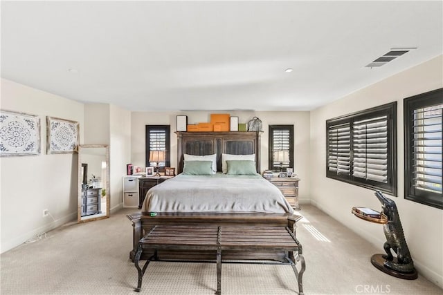 7925 Hemingway Ct, Fontana, CA 92336 - bedroom featuring multiple windows, light carpet, and baseboards