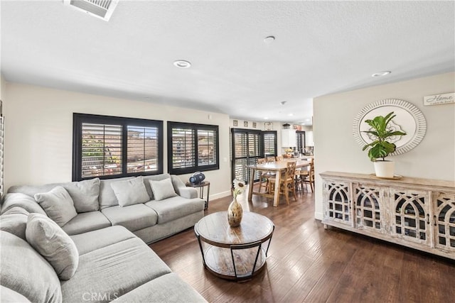 7925 Hemingway Ct, Fontana, CA 92336 - living room featuring wood-type flooring, recessed lighting, and baseboards