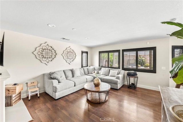 7925 Hemingway Ct, Fontana, CA 92336 - living room featuring baseboards, dark wood-style floors, and recessed lighting