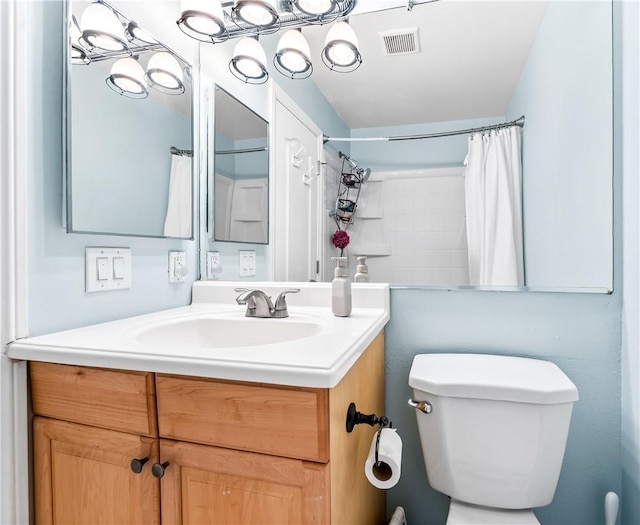 7890 E Spring St Unit 22F, Long Beach, CA 90815 - bathroom featuring vanity, toilet, and curtained shower