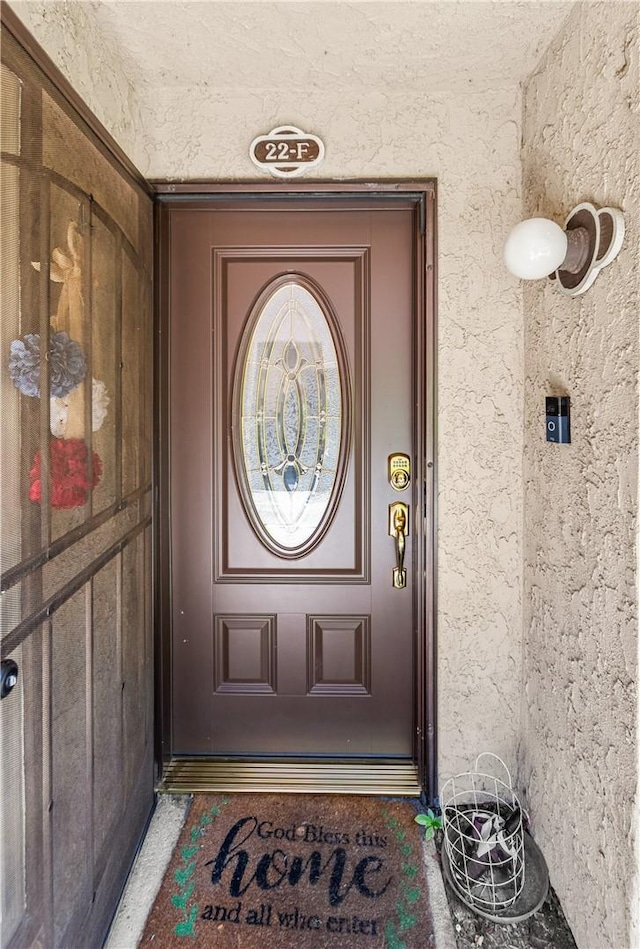 7890 E Spring St Unit 22F, Long Beach, CA 90815 - doorway to property with stucco siding